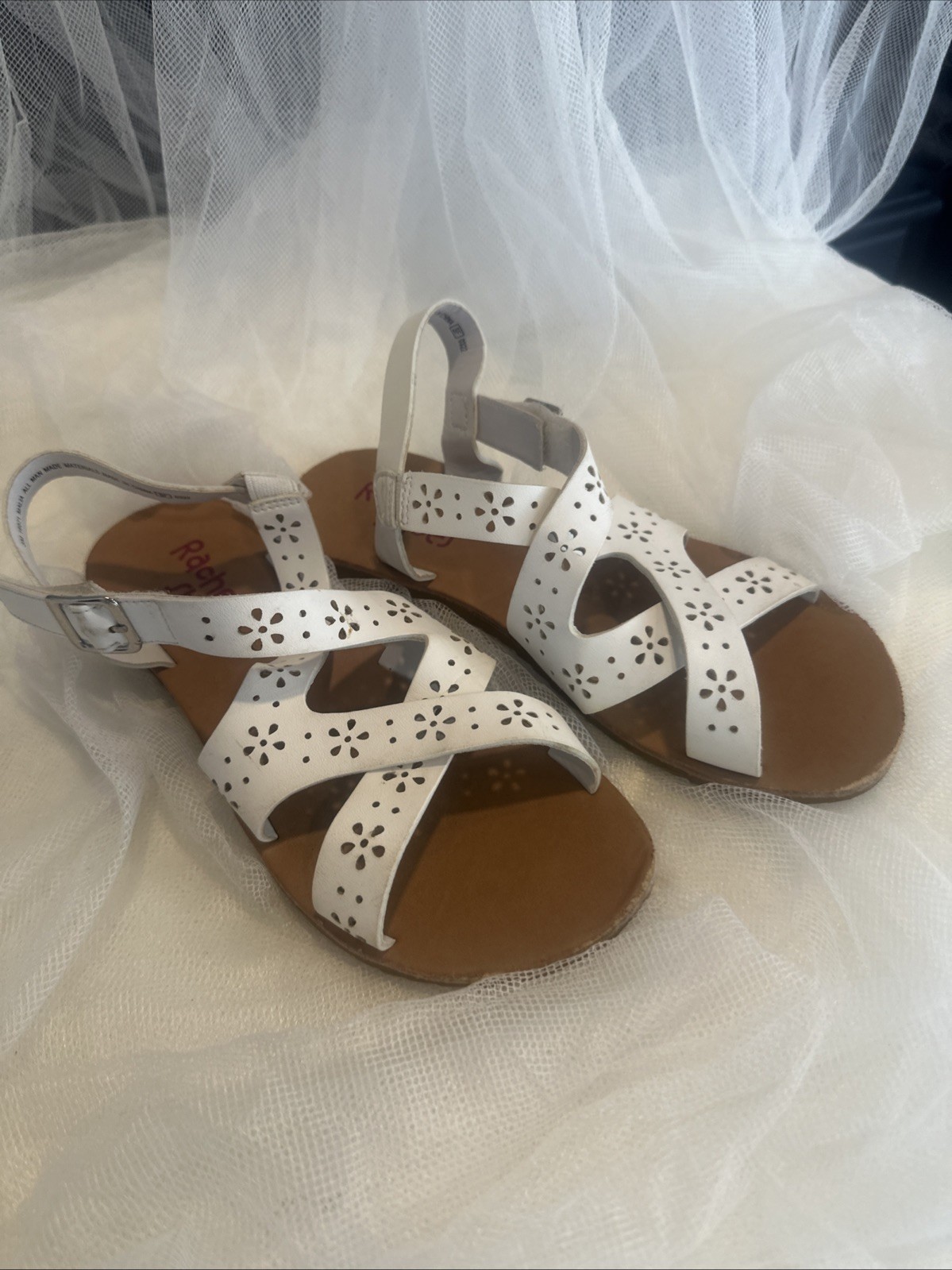 white faux leather Rachel Shoes sandals with a floral pattern