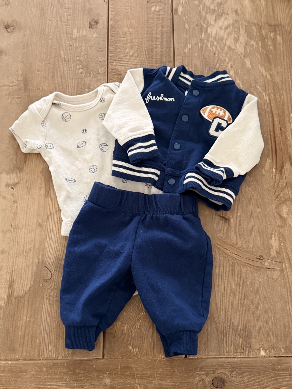 Carter’s newborn 0m 3-piece outfit, pants, shirt, and, jacket. Football theme