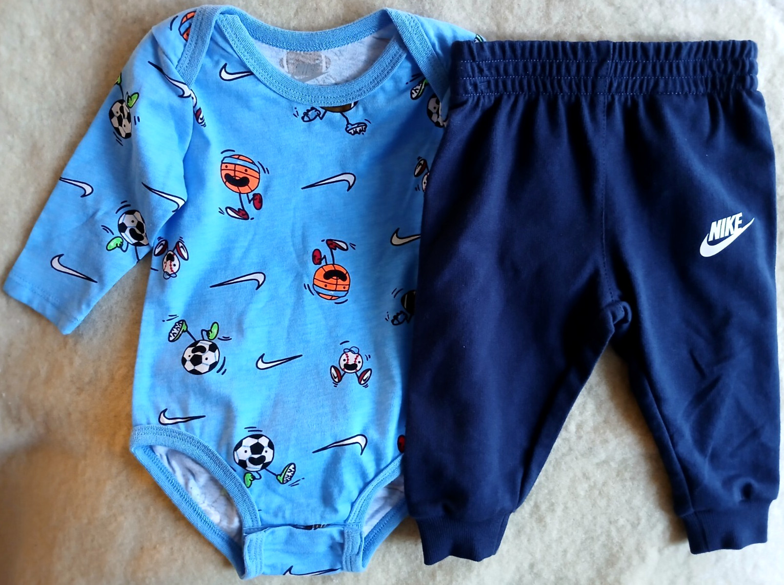 NIKE**BLUE 2 PIECE PANTS OUTFIT WITH SPORTS BALLS-SIZE 6 MONTHS-NEW WITH TAGS