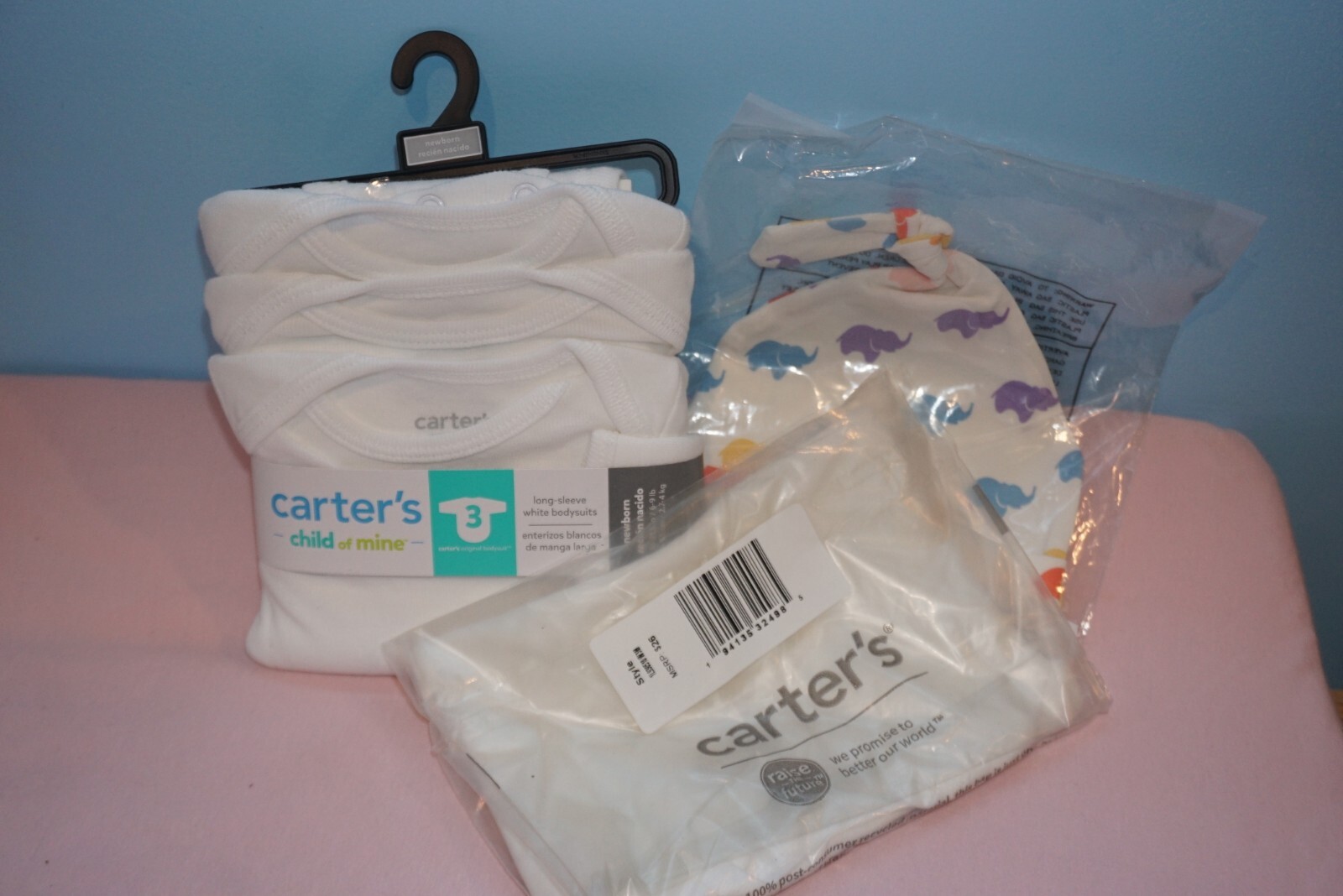 Gender-neutral baby clothes: Carter’s bodysuits NB and 3 mo, baby top knot cap