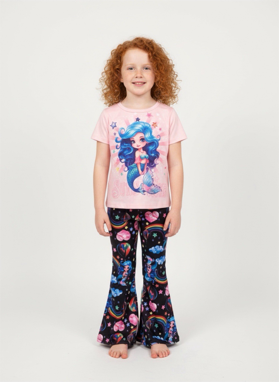 Pink mermaid graphic t-shirt and matching flared pants.