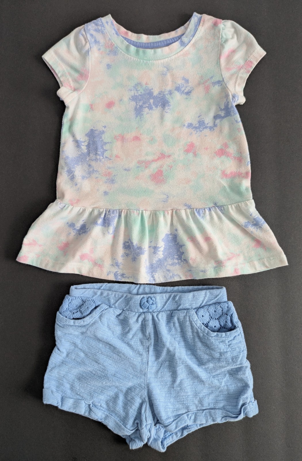 2 Pc’s Size: 2T Blue, Pink Tie-Dye S/S Peplum Shirt, Size: 24 Months Blue Shorts